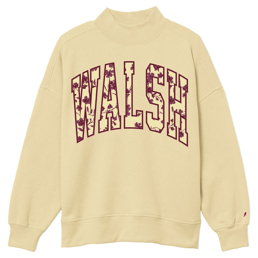 A cream-colored crewneck sweatshirt featuring the word 'WALSH' printed across the chest in a burgundy collegiate font with a floral pattern fill. A small red embroidered logo is visible on the left sleeve cuff.